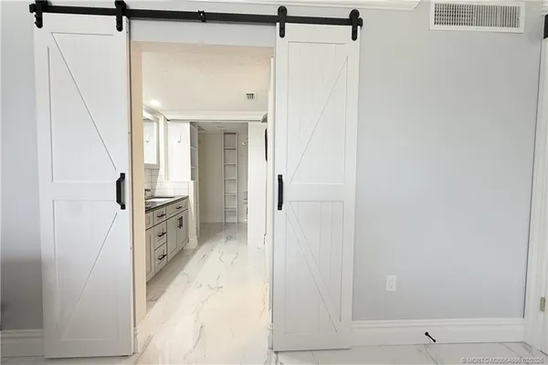 a view of a kitchen from the hallway