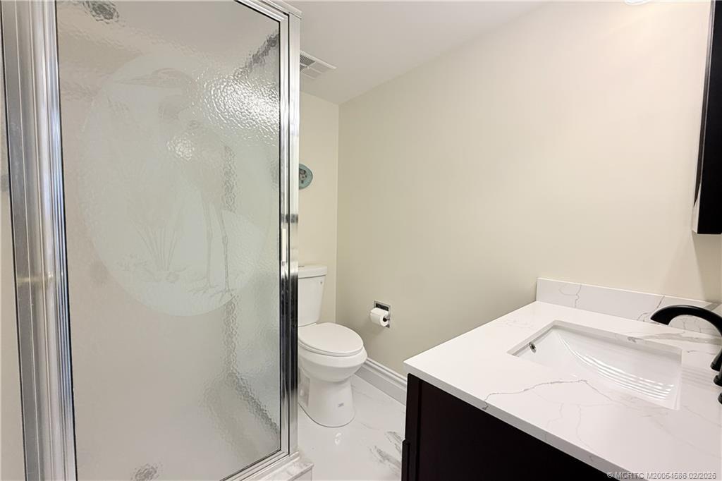 1950 Southwest Palm City Road, Unit 3309 Stuart, FL 34994 - Photo 26 of 32 a bathroom with a sink toilet and shower