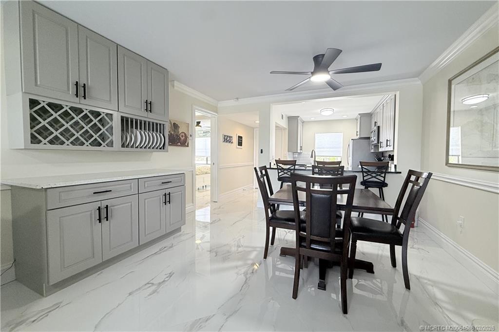 1950 Southwest Palm City Road, Unit 3309 Stuart, FL 34994 - Photo 8 of 32 a view of a dining room with furniture