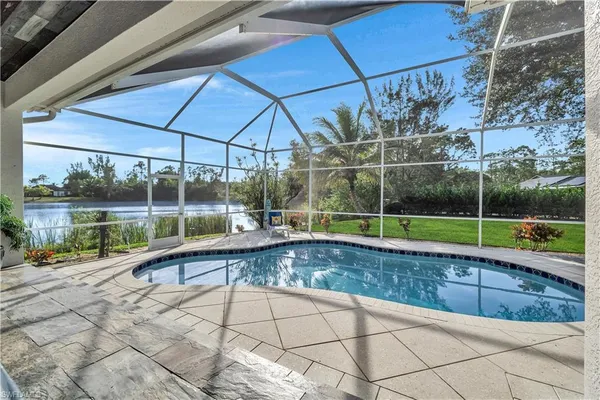 a view of a backyard with a swimming pool