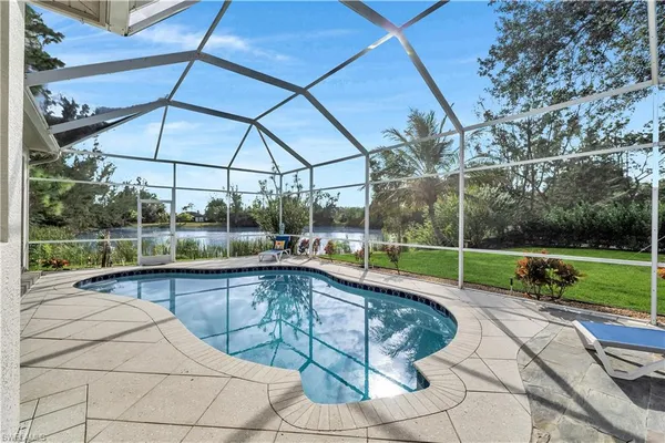 a view of a swimming pool with a patio