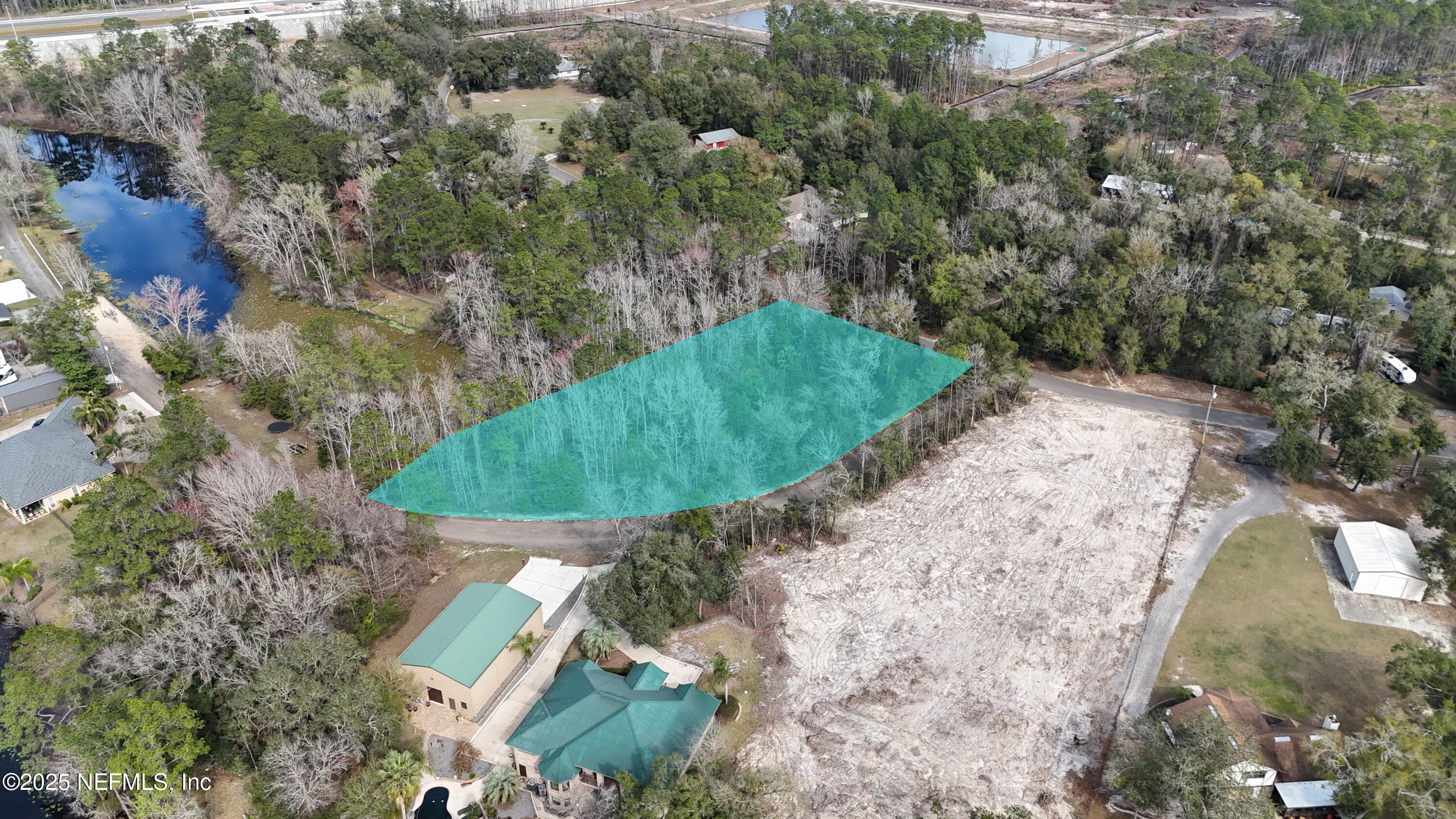 2170 Winchester Road Green Cove Springs, FL 32043 - Photo 13 of 39 an aerial view of a house with a yard and trees