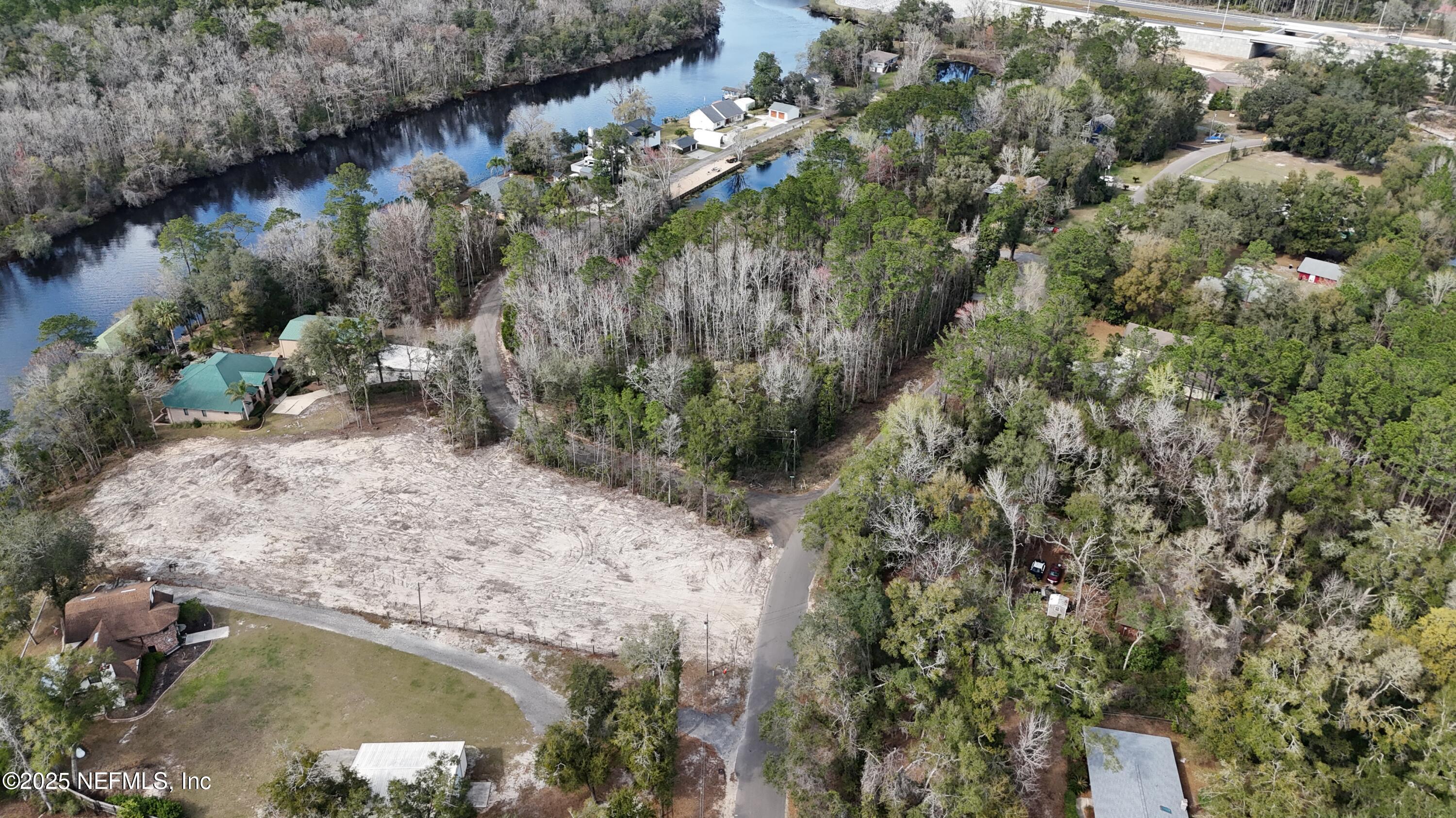 2170 Winchester Road Green Cove Springs, FL 32043 - Photo 16 of 39 a view of a lake in middle of forest