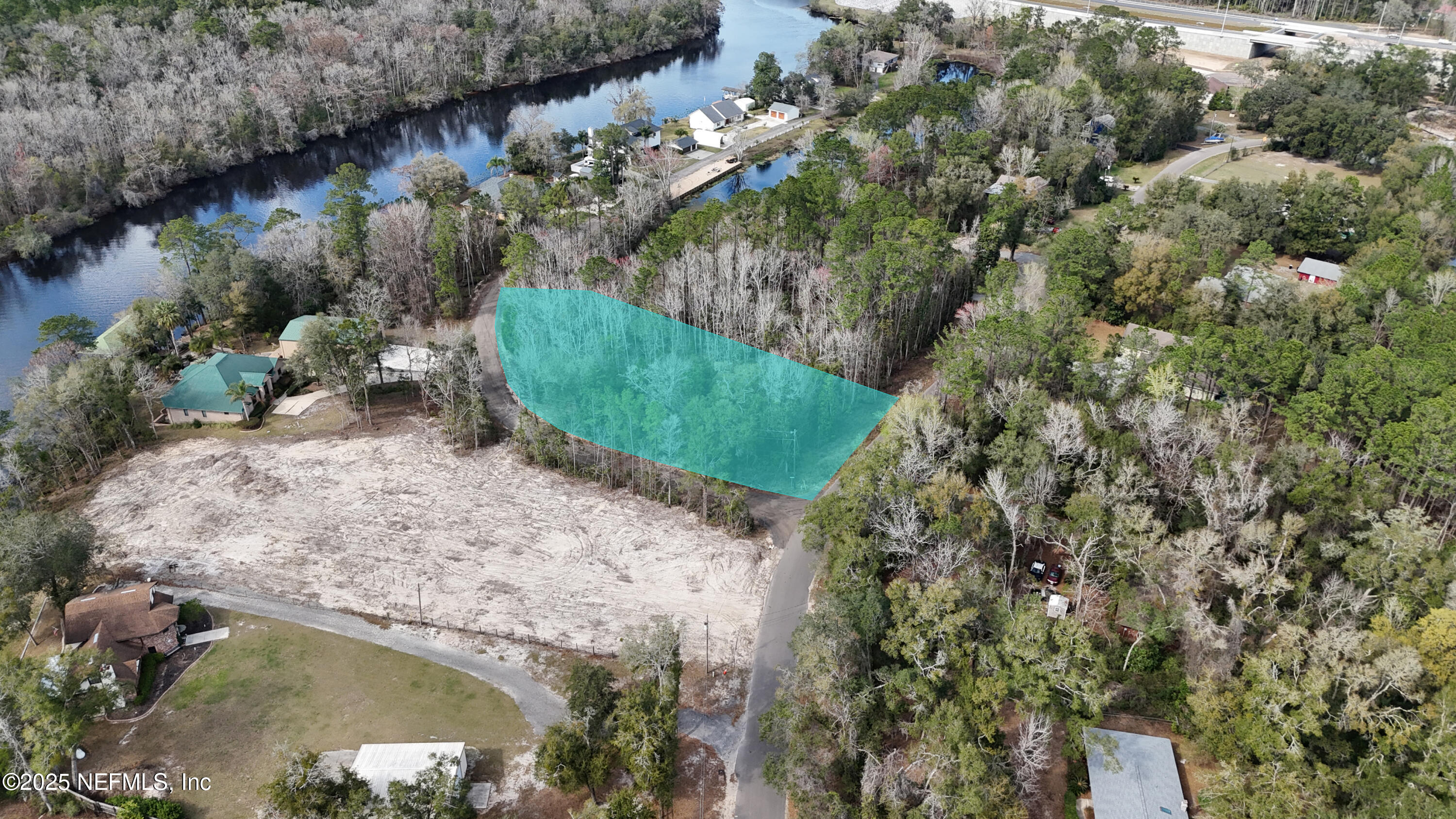 2170 Winchester Road Green Cove Springs, FL 32043 - Photo 17 of 39 a view of a lake from a yard