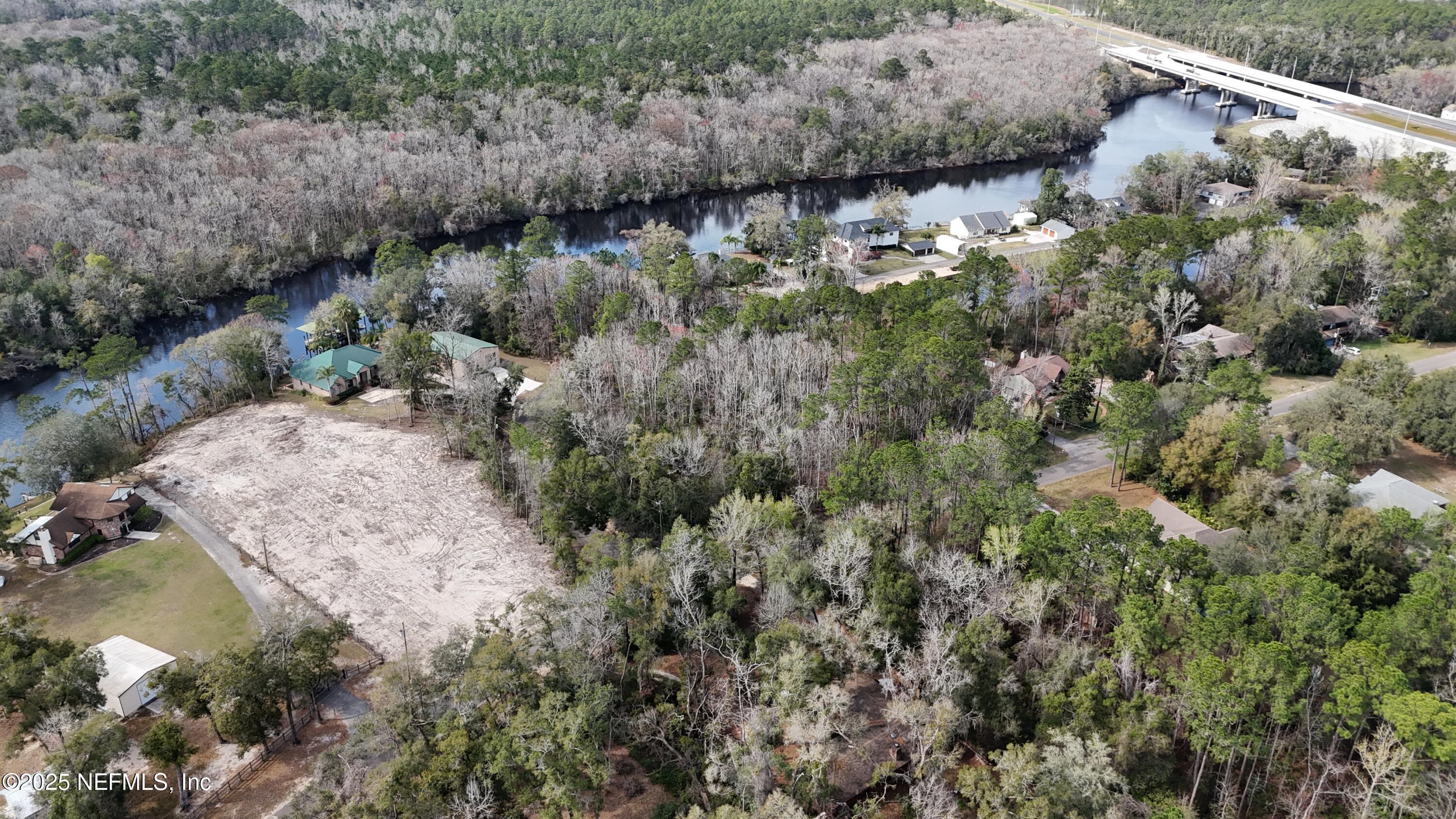 2170 Winchester Road Green Cove Springs, FL 32043 - Photo 18 of 39 a view of a lake with a forest
