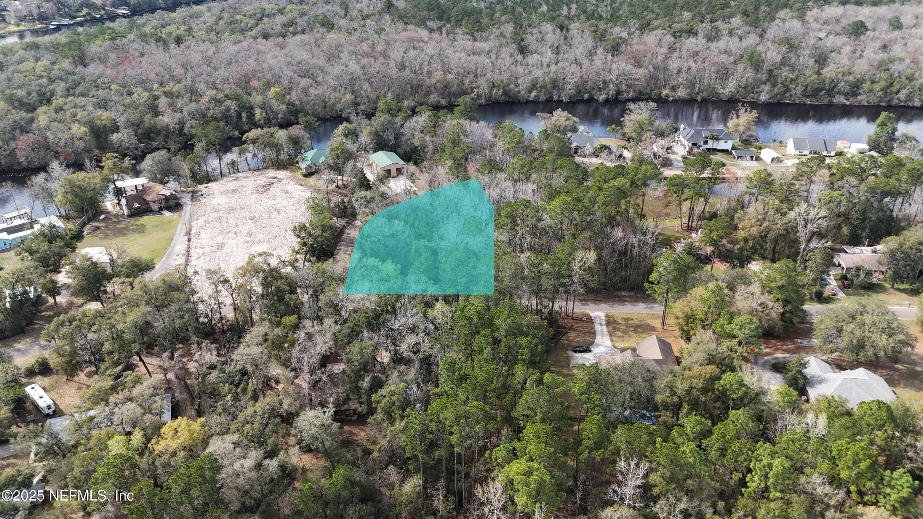 2170 Winchester Road Green Cove Springs, FL 32043 - Photo 2 of 39 a view of a lake with large trees