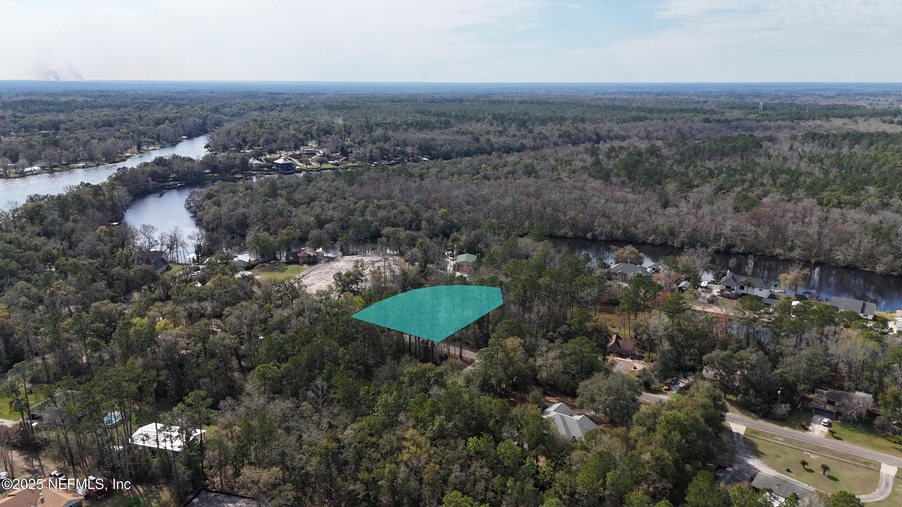 2170 Winchester Road Green Cove Springs, FL 32043 - Photo 23 of 39 an aerial view of a house with a yard and mountain view