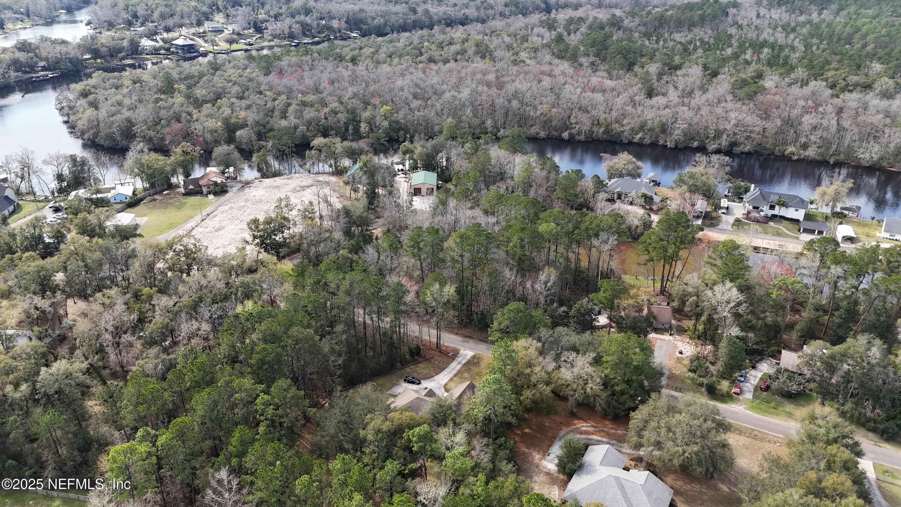 2170 Winchester Road Green Cove Springs, FL 32043 - Photo 3 of 39 a view of a lake with lots of trees