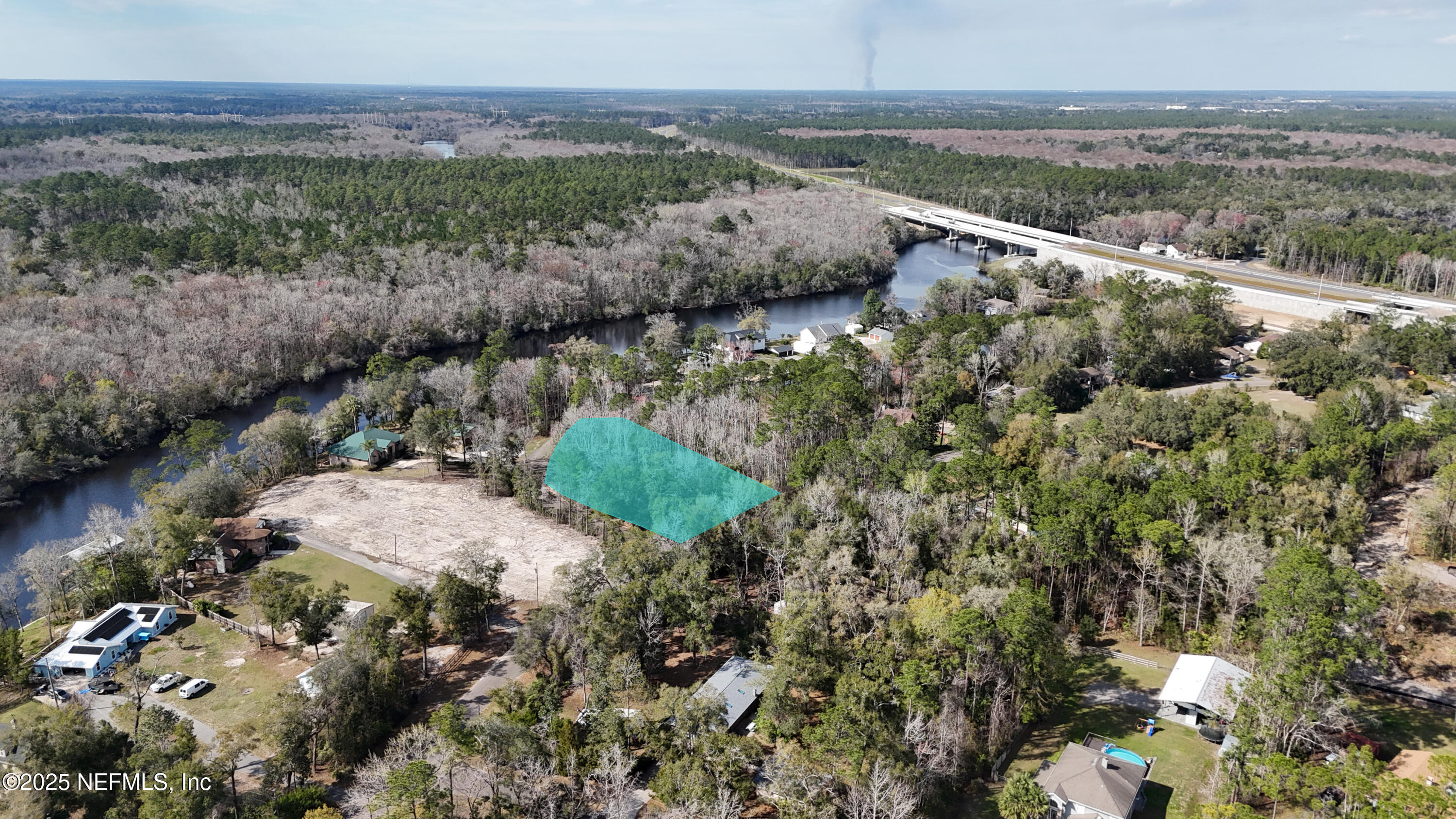 2170 Winchester Road Green Cove Springs, FL 32043 - Photo 39 of 39 a view of a lake with green field and mountains