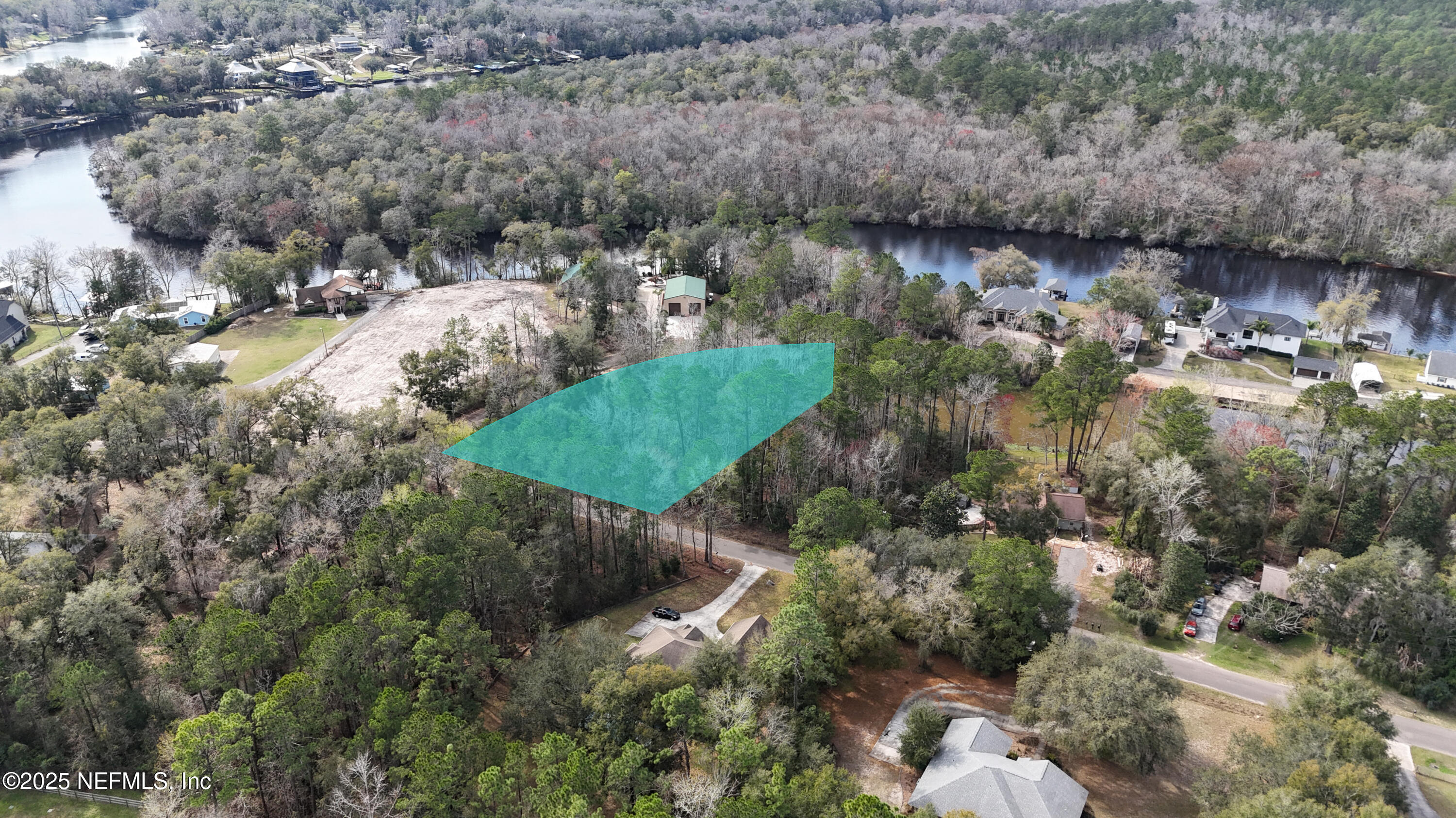 2170 Winchester Road Green Cove Springs, FL 32043 - Photo 4 of 39 a view of a lake with large trees
