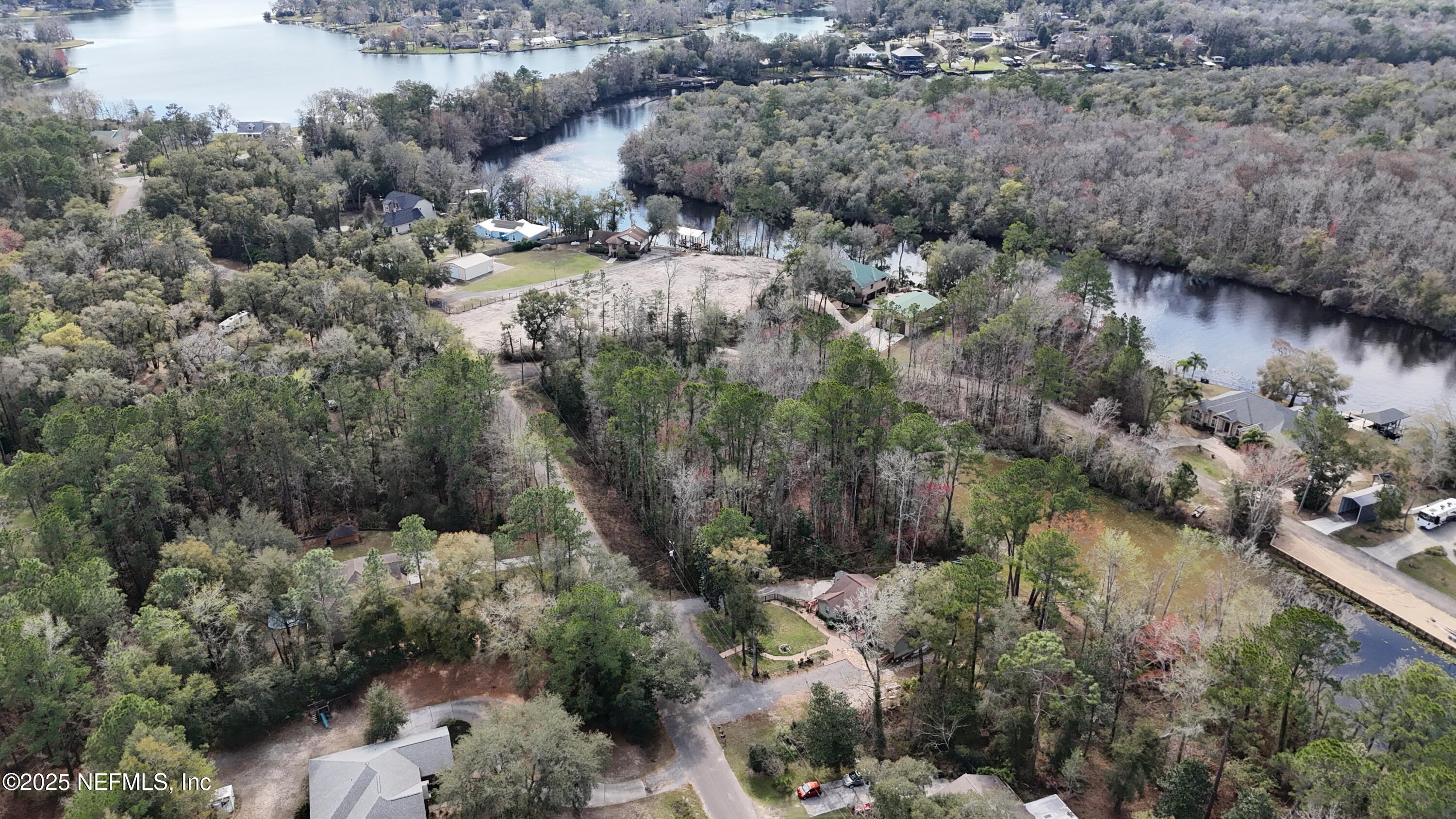 2170 Winchester Road Green Cove Springs, FL 32043 - Photo 5 of 39 a view of a lake with large trees