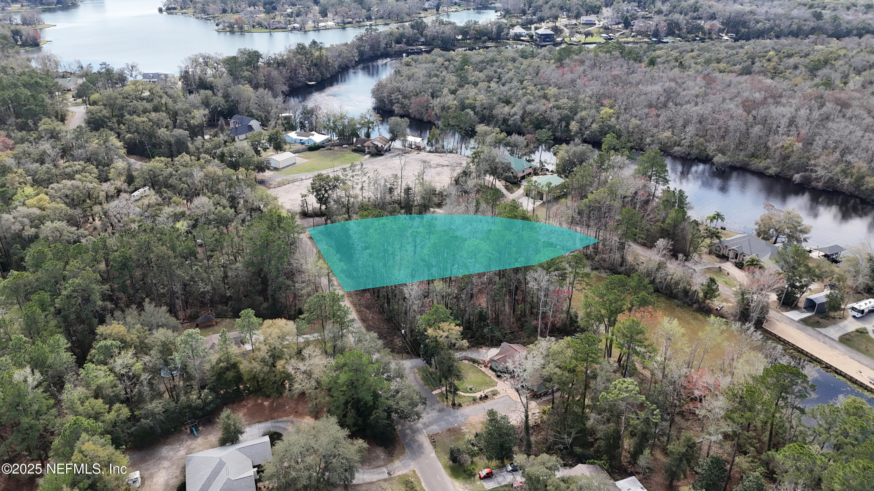 2170 Winchester Road Green Cove Springs, FL 32043 - Photo 6 of 39 an aerial view of a house with a yard and lake view