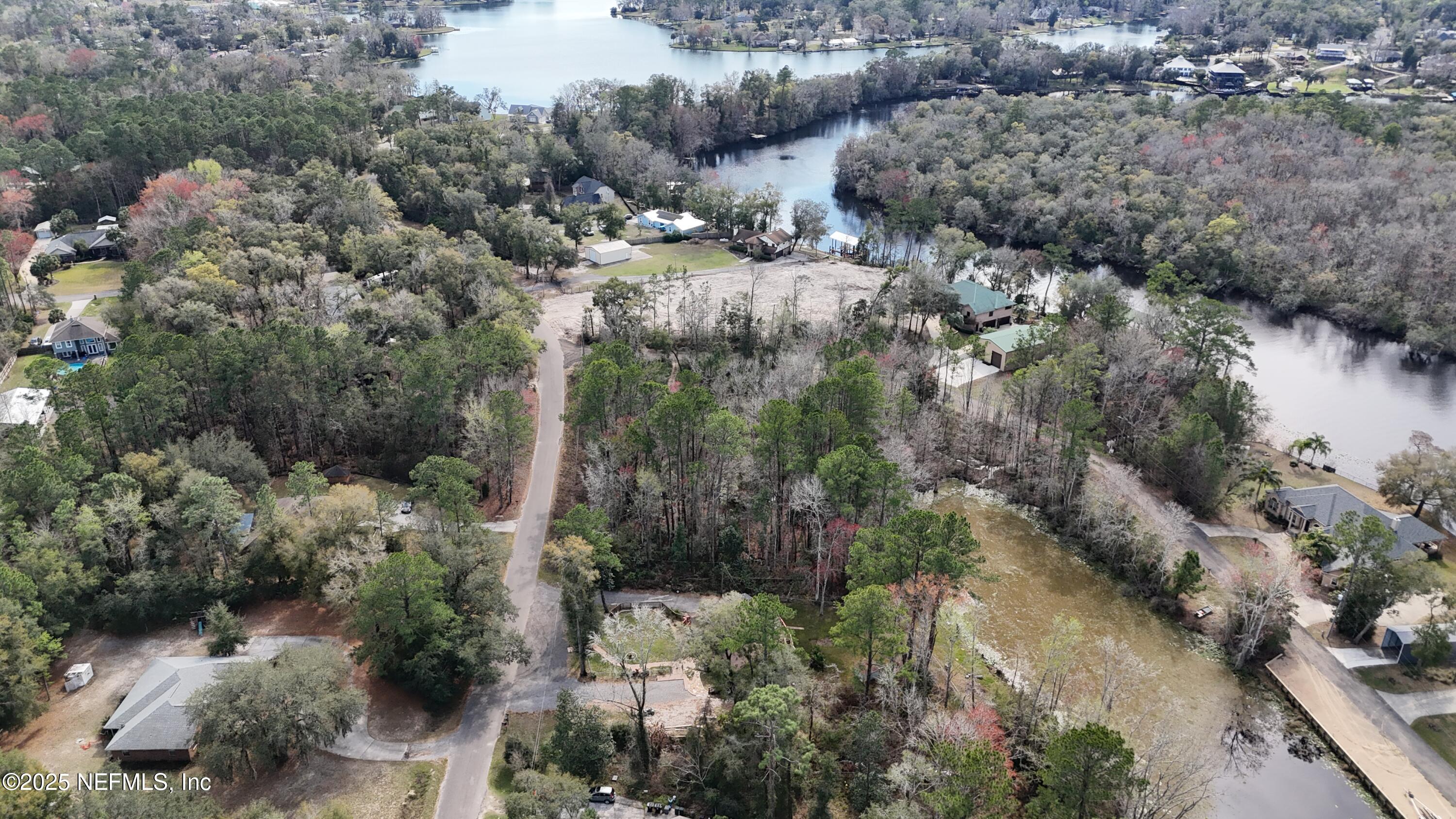 2170 Winchester Road Green Cove Springs, FL 32043 - Photo 7 of 39 a view of a city with lush green forest