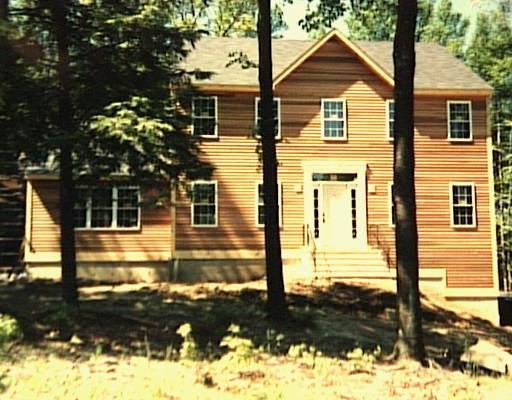 87 R Horseshoe Ridge Road Newtown, CT 06482 - Photo 1 of 1 a front view of a house with a yard