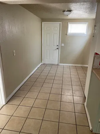 a kitchen with stainless steel appliances a stove a sink and a refrigerator