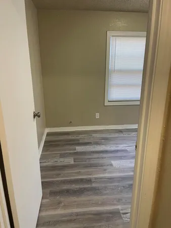 a bathroom with a toilet a sink and a mirror