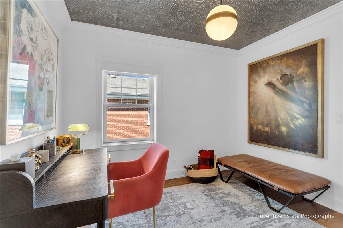 305 Clinton Avenue Elmhurst, IL 60126 - Photo 13 of 31 a living room with furniture and a window