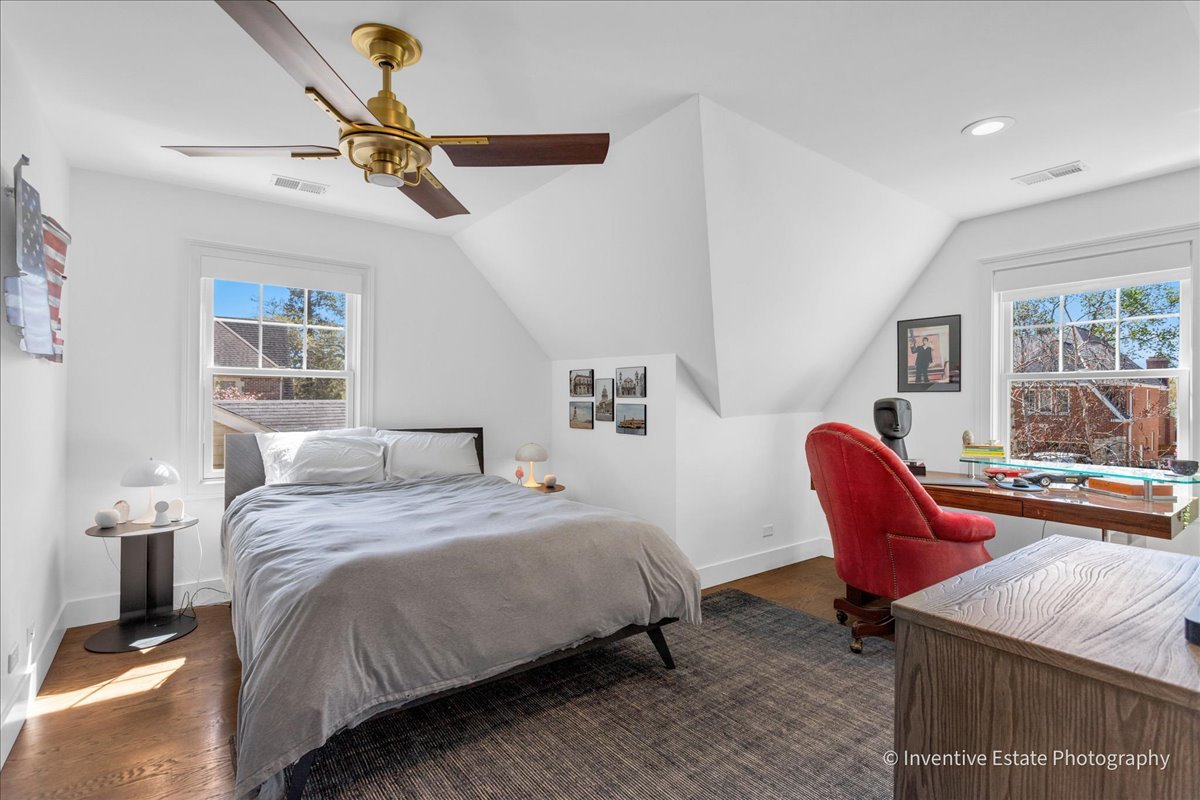 305 Clinton Avenue Elmhurst, IL 60126 - Photo 16 of 31 a bedroom with a bed a couch and a window