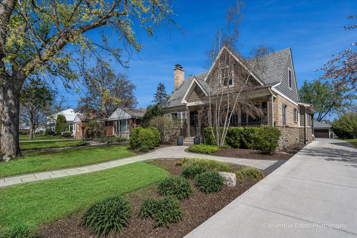 305 Clinton Avenue Elmhurst, IL 60126 - Photo 2 of 31 a front view of a house with a yard