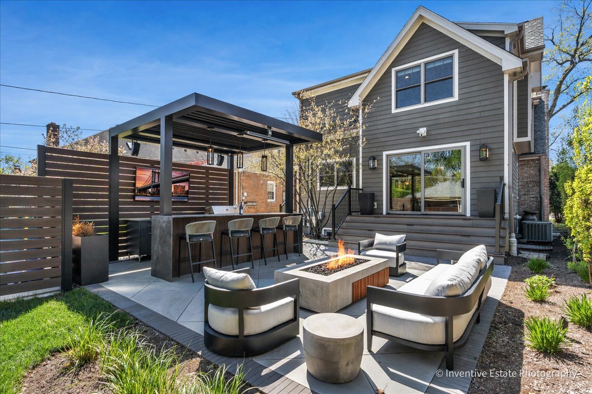 305 Clinton Avenue Elmhurst, IL 60126 - Photo 26 of 31 a view of a patio with couches table and chairs and potted plants