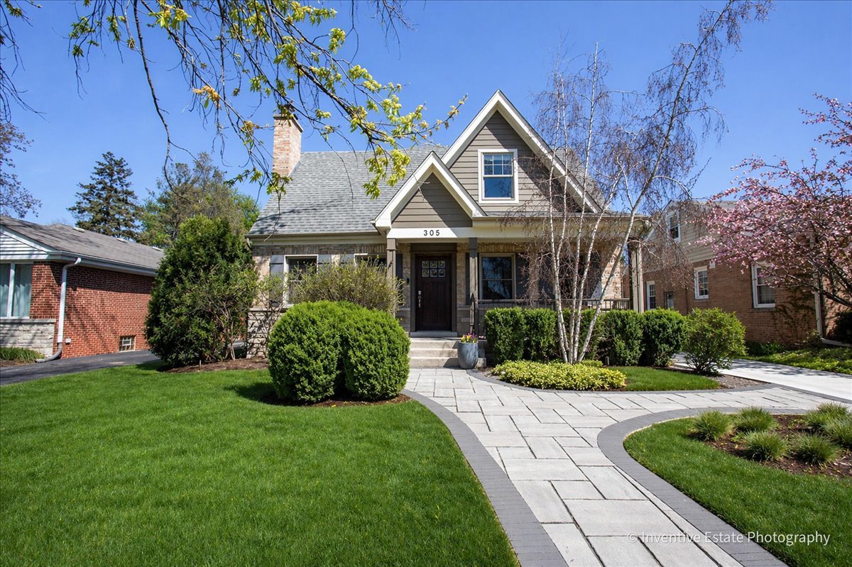 305 Clinton Avenue Elmhurst, IL 60126 - Photo 3 of 31 a front view of a house with garden