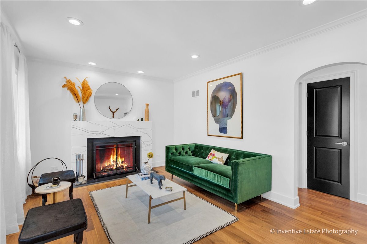 305 Clinton Avenue Elmhurst, IL 60126 - Photo 5 of 31 a living room with furniture and a fireplace