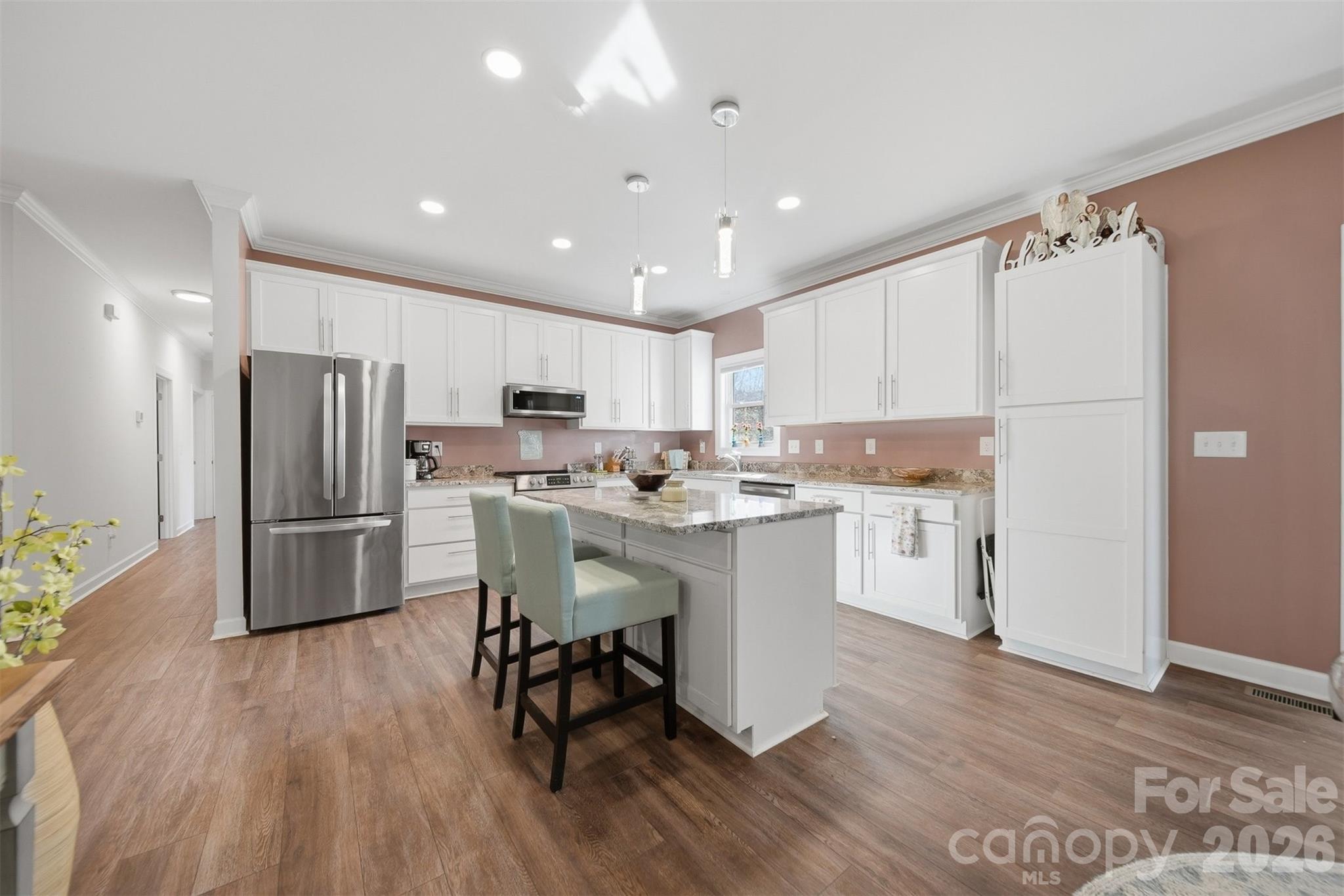 976 Amherst Road Morganton, NC 28655 - Photo 11 of 38 a kitchen with a refrigerator a sink and a stove top oven