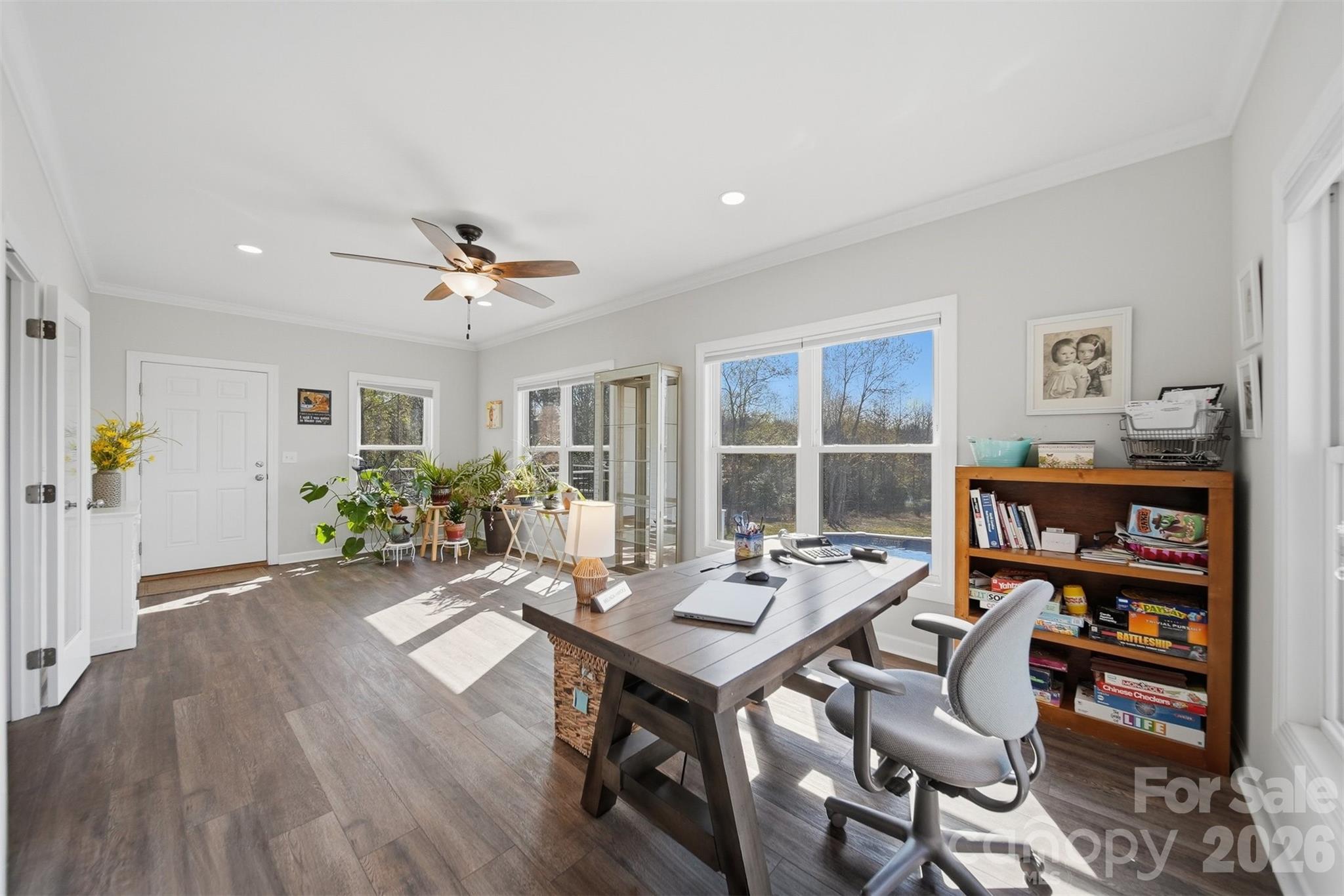 976 Amherst Road Morganton, NC 28655 - Photo 17 of 38 a workspace with furniture and a book shelf