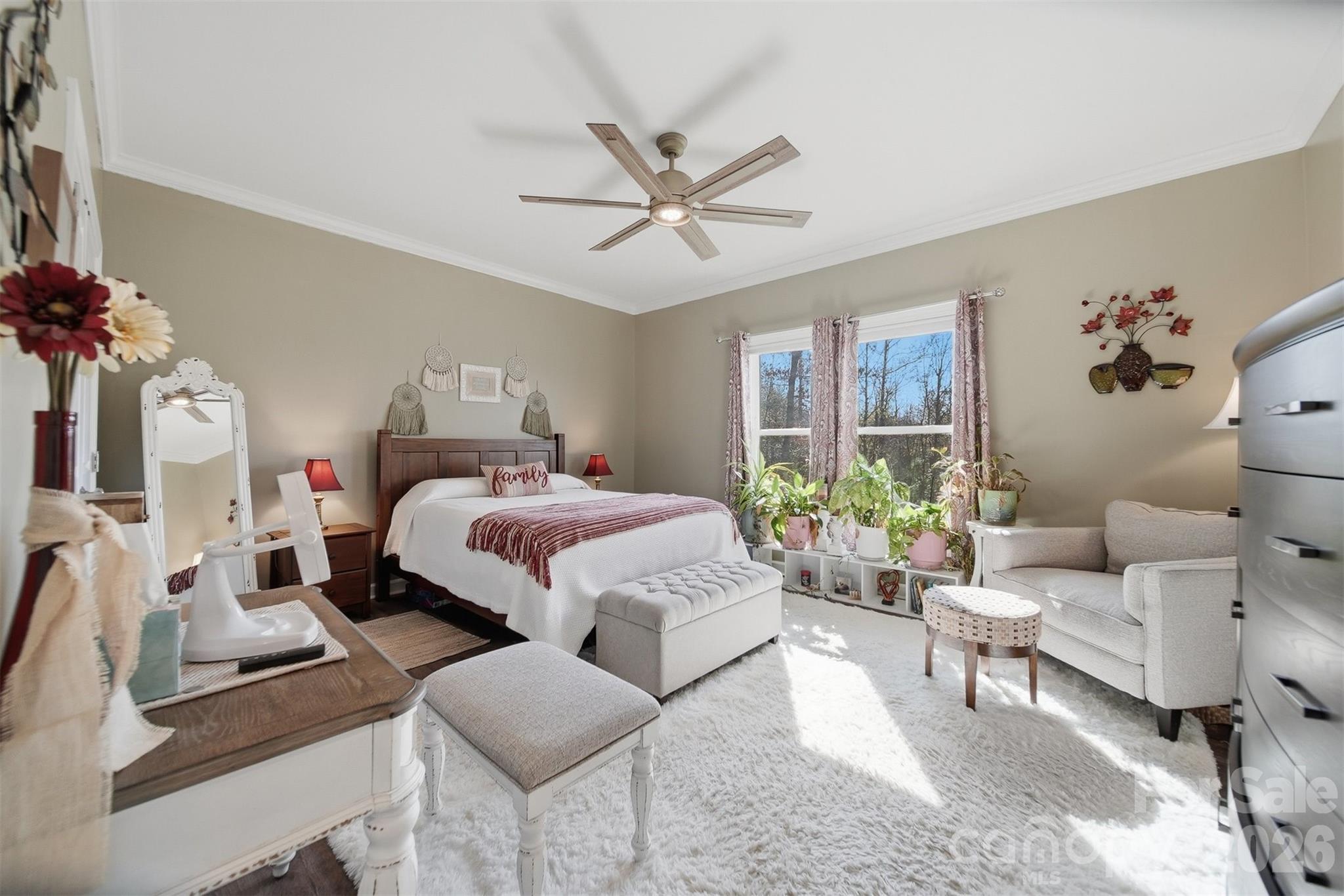 976 Amherst Road Morganton, NC 28655 - Photo 19 of 38 a bedroom with a bed a couch and potted plant on the dresser