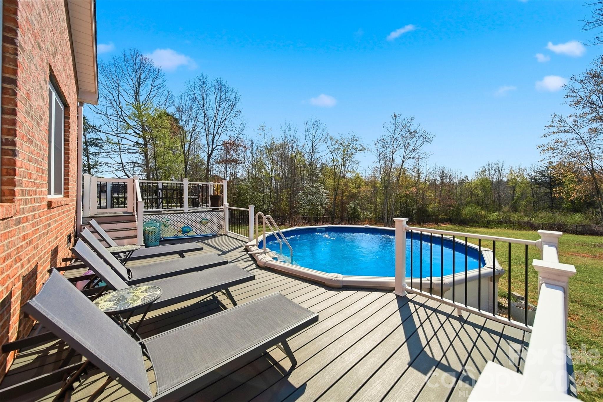 976 Amherst Road Morganton, NC 28655 - Photo 28 of 38 a view of a roof deck with couches and wooden floor