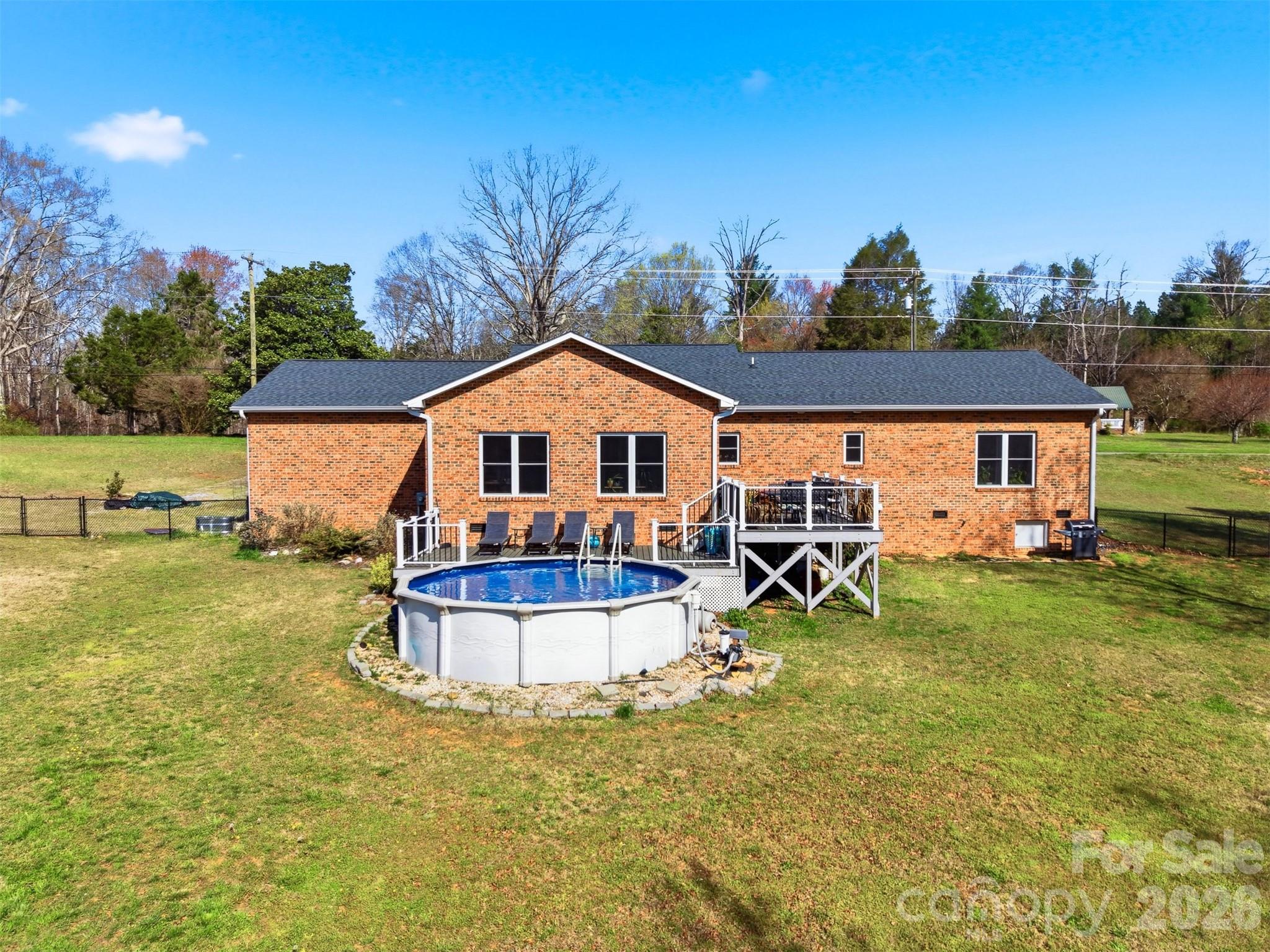 976 Amherst Road Morganton, NC 28655 - Photo 29 of 38 a front view of a house with a yard table and chairs