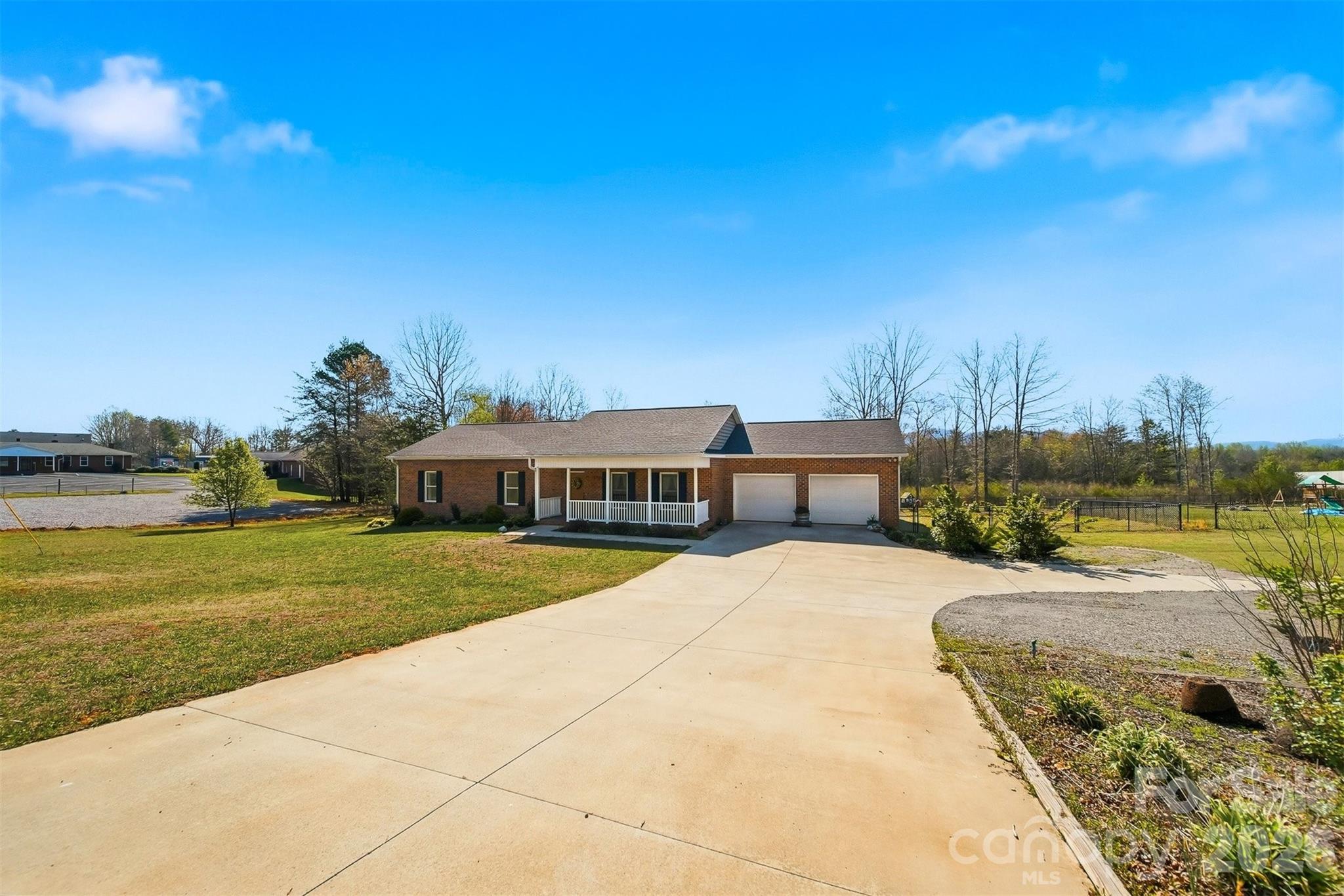 976 Amherst Road Morganton, NC 28655 - Photo 3 of 38 a view of a house with a yard and lake view