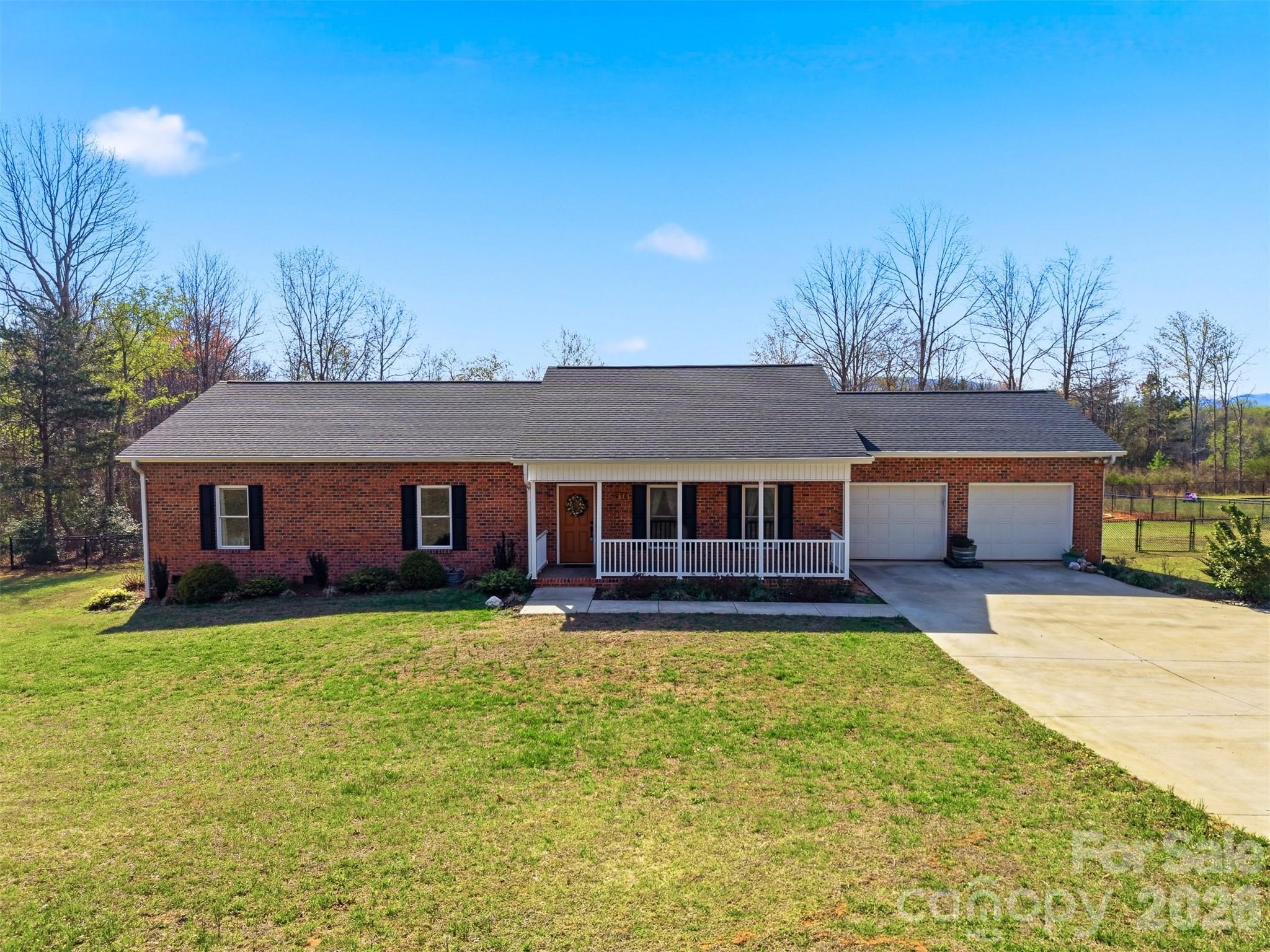976 Amherst Road Morganton, NC 28655 - Photo 35 of 38 front view of a house with yard with trees
