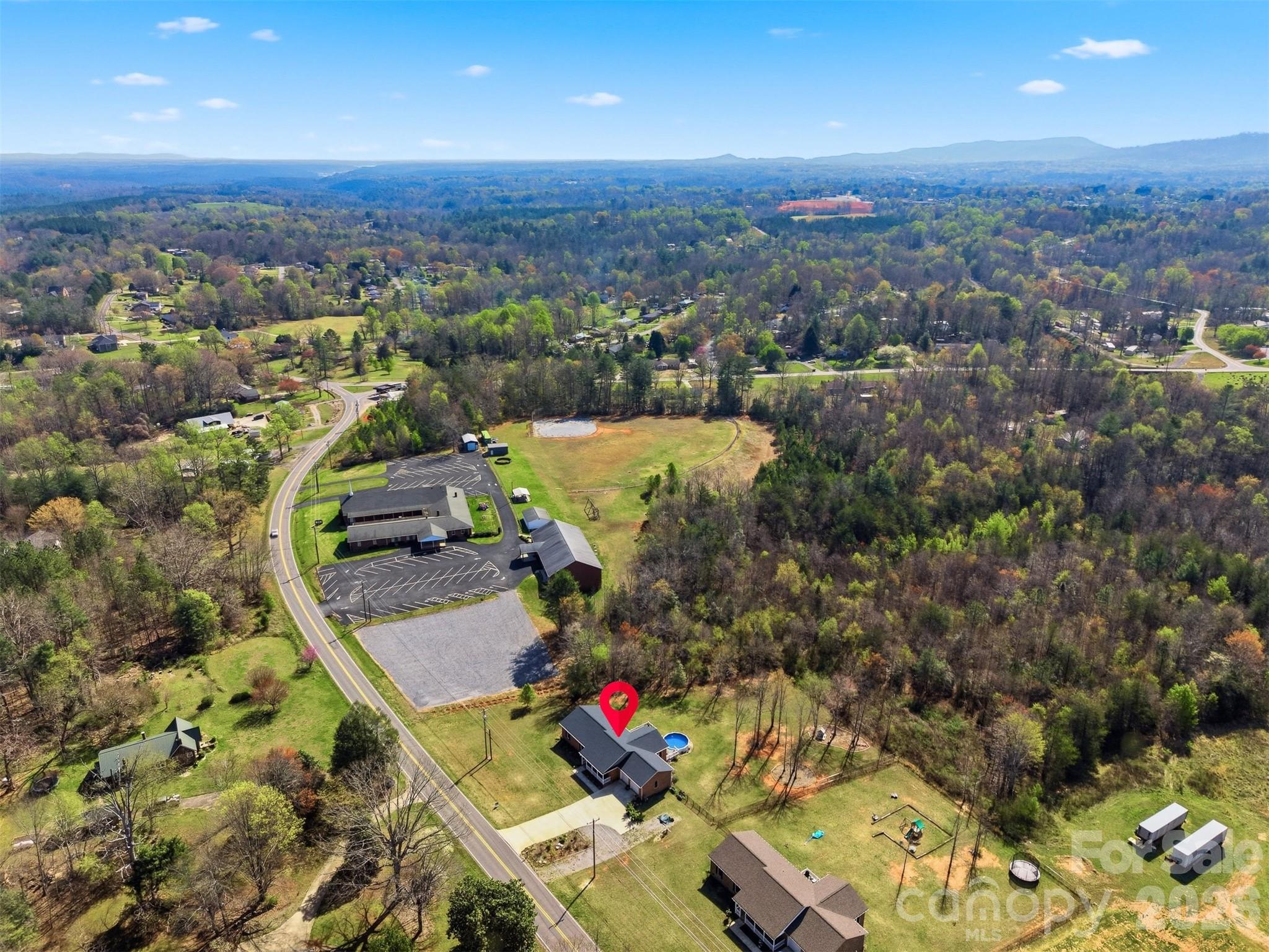 976 Amherst Road Morganton, NC 28655 - Photo 37 of 38 an aerial view of residential houses with outdoor space