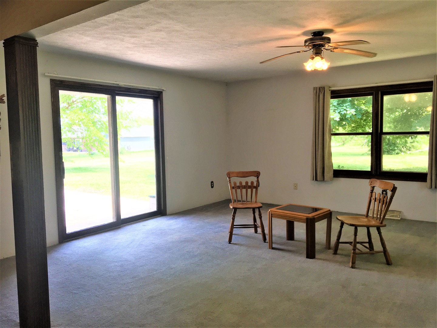 6939 North Junction Road Davis Junction, IL 61020 - Photo 11 of 31 a view of a livingroom with furniture and a ceiling fan