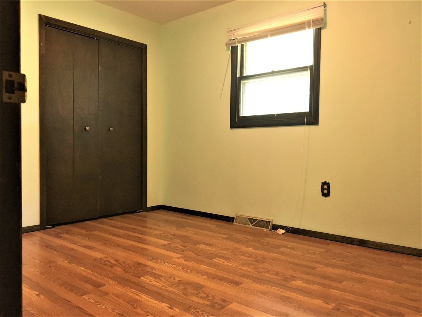 6939 North Junction Road Davis Junction, IL 61020 - Photo 14 of 31 an empty room with wooden floor and windows