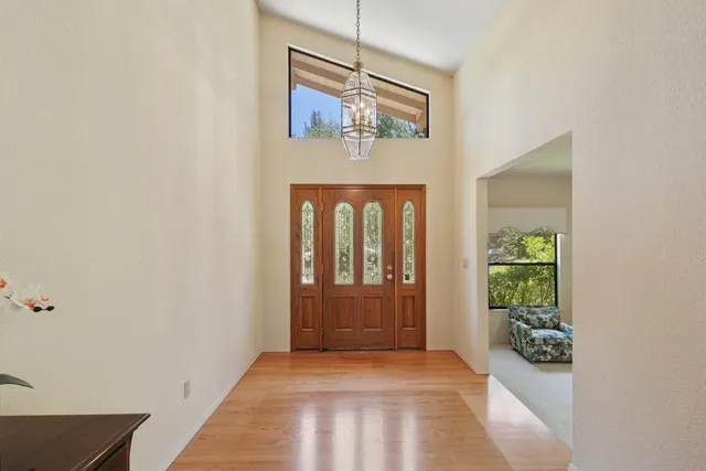 a living room with furniture fireplace and window