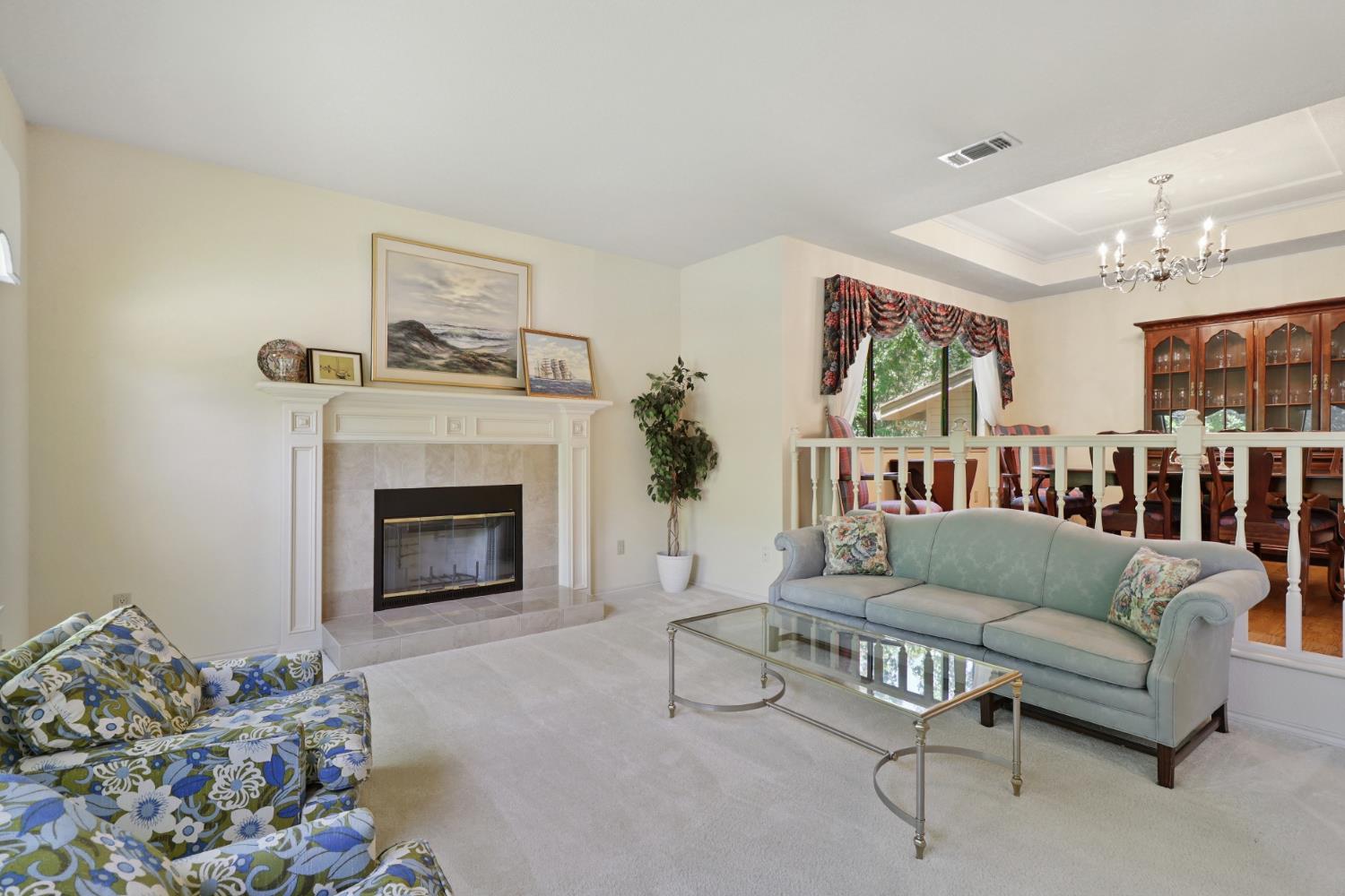 6798 Terreno Drive Rancho Murieta, CA 95683 - Photo 14 of 63 a living room with furniture and a fireplace