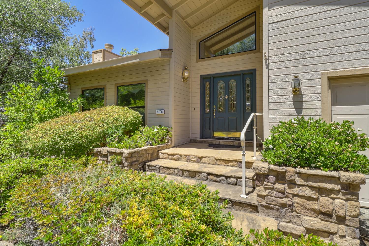 6798 Terreno Drive Rancho Murieta, CA 95683 - Photo 2 of 63 front view of house with a yard