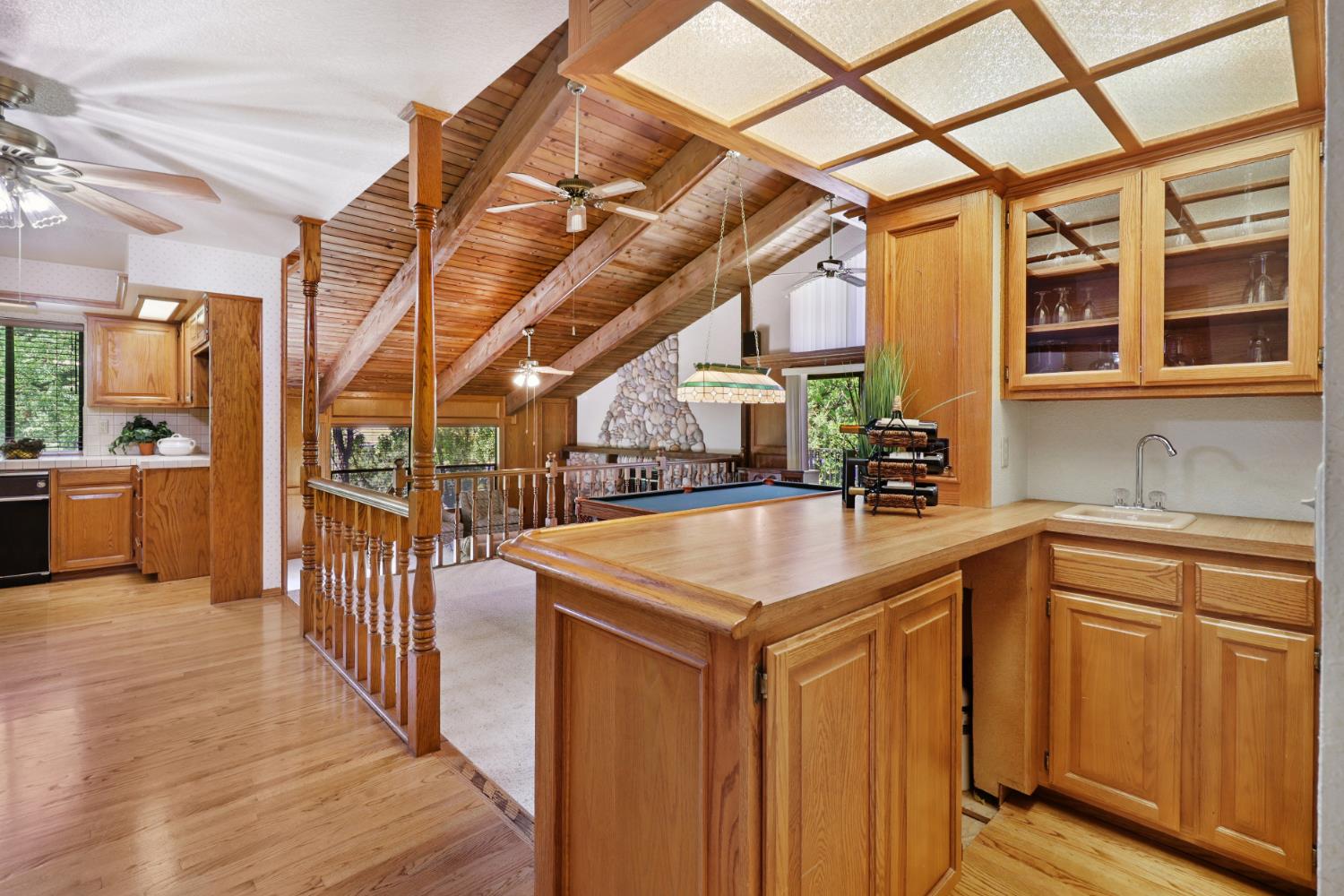 6798 Terreno Drive Rancho Murieta, CA 95683 - Photo 27 of 63 a kitchen with stainless steel appliances granite countertop a sink and dishwasher with wooden floor