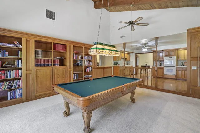 a bed room with a bed and a chandelier