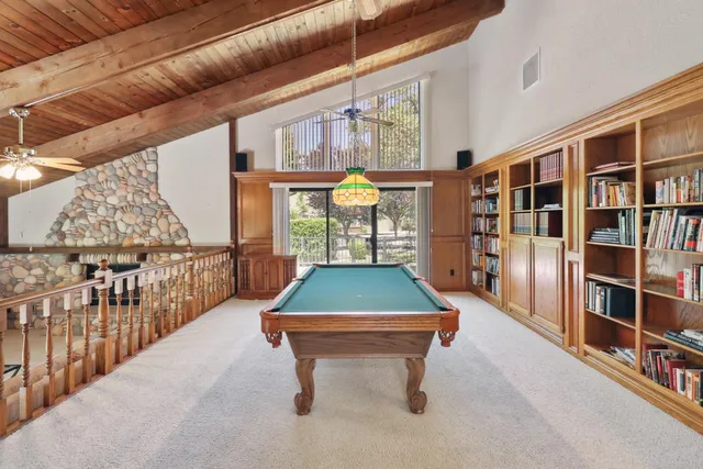 a bedroom with a bed and a tv on the dresser