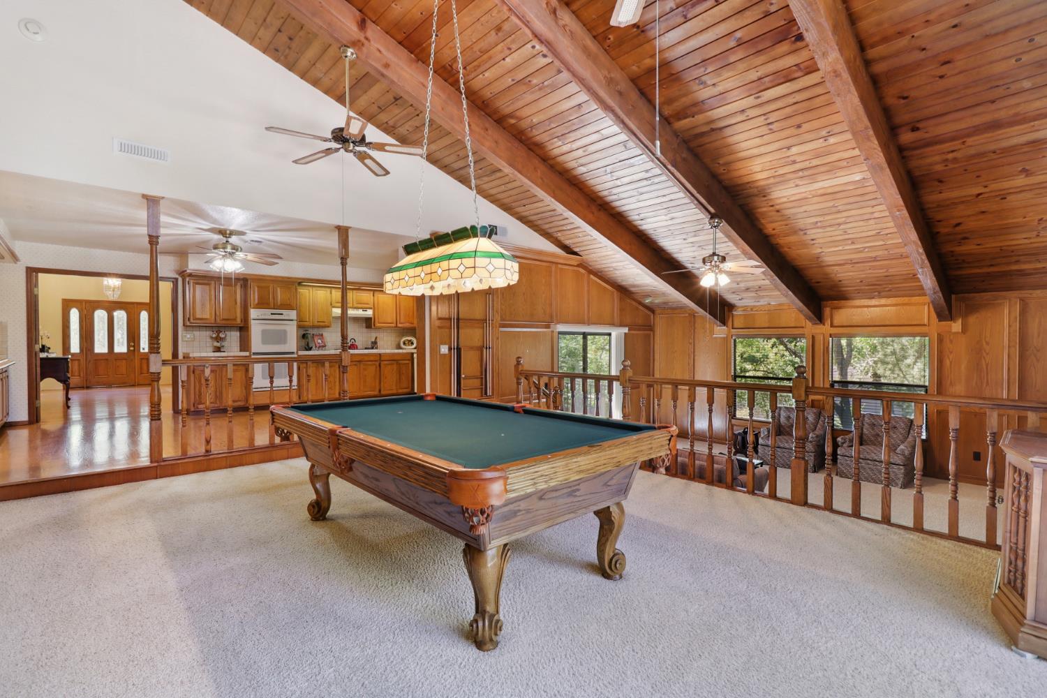 6798 Terreno Drive Rancho Murieta, CA 95683 - Photo 32 of 63 a room with lots of furniture and windows