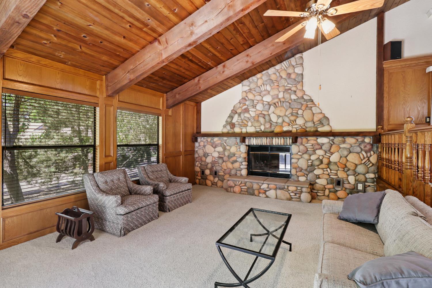 6798 Terreno Drive Rancho Murieta, CA 95683 - Photo 35 of 63 a living room with furniture and a fireplace