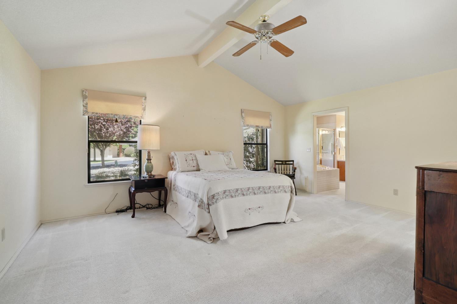 6798 Terreno Drive Rancho Murieta, CA 95683 - Photo 37 of 63 a bed room with a bed and a chandelier