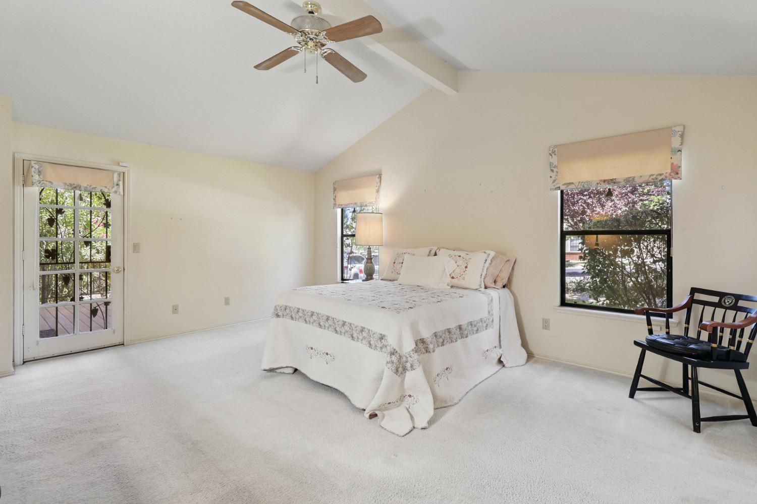 6798 Terreno Drive Rancho Murieta, CA 95683 - Photo 38 of 63 a spacious bedroom with a bed a table and chair