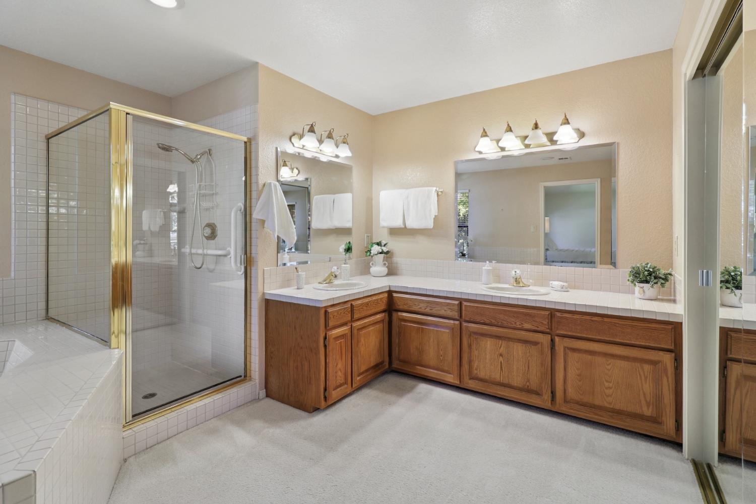 6798 Terreno Drive Rancho Murieta, CA 95683 - Photo 41 of 63 a spacious bathroom with a double vanity sink mirror and double