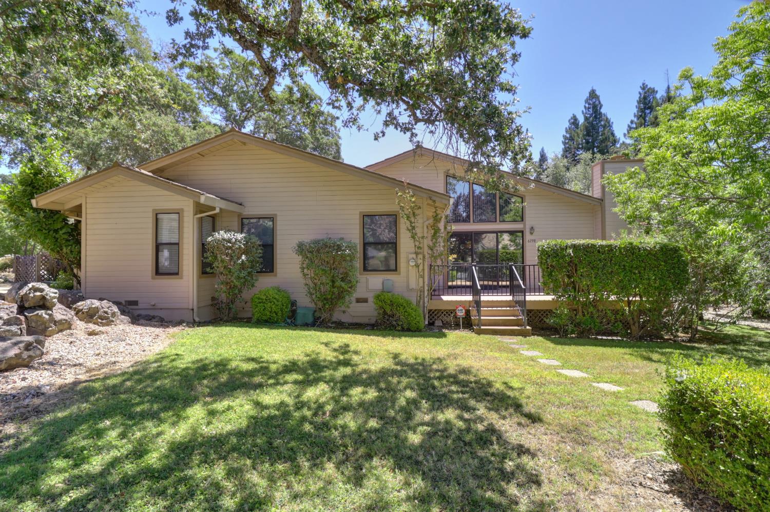 6798 Terreno Drive Rancho Murieta, CA 95683 - Photo 50 of 63 a backyard of a house with yard and outdoor seating