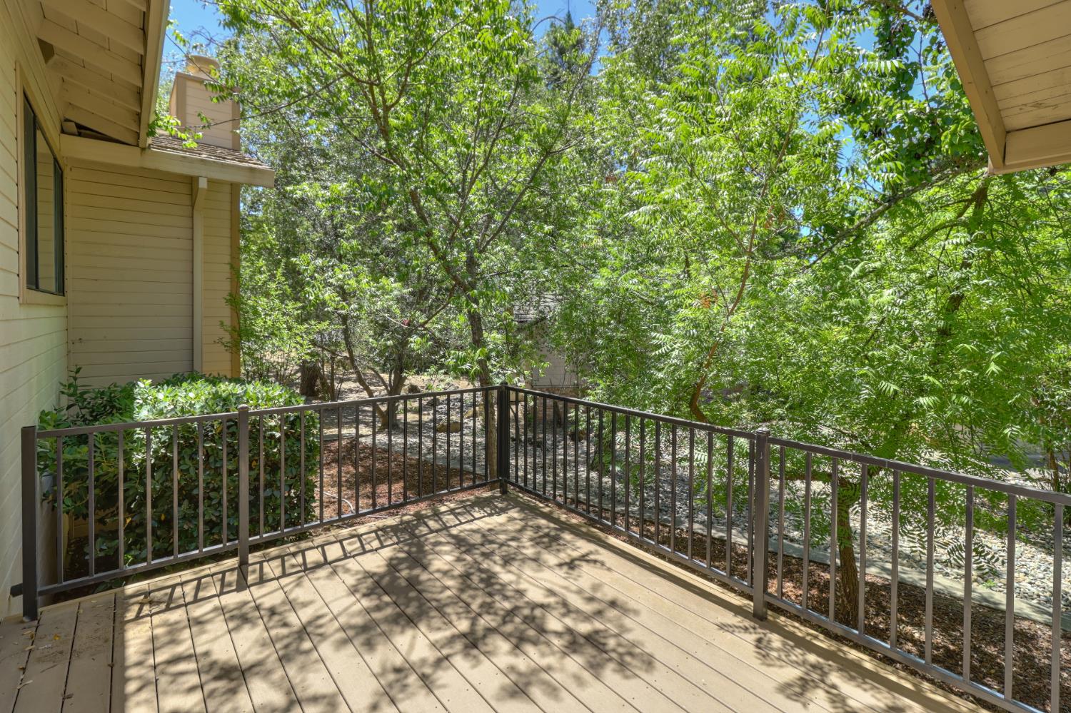 6798 Terreno Drive Rancho Murieta, CA 95683 - Photo 59 of 63 a view of a balcony with wooden fence