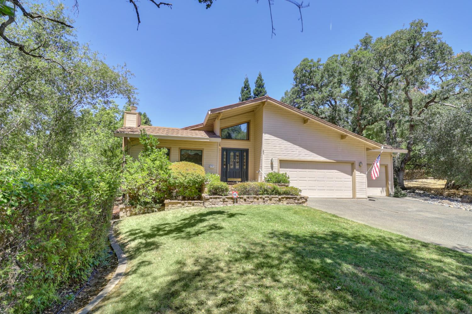 6798 Terreno Drive Rancho Murieta, CA 95683 - Photo 62 of 63 a yellow house with tree in front of it